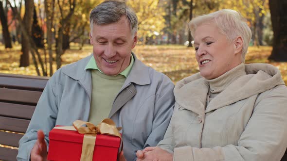 Portrait Elderly Man Rejoices Gift Surprise Mature Grandpa Throwing Red Box Feel Happy Married alt