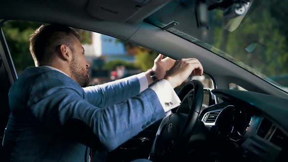 Office worker is late for work, honking and screaming while standing in a traffic jam