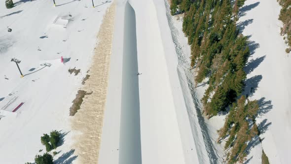 Aerial Ski and Snowboard Footage Skilled Professional Snowboarder Halfpipe alt