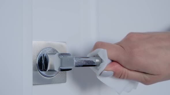 Slow Motion: Woman Cleaning Door Handle with Wet Wipe - Disinfection Concept