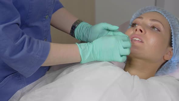 Rubbing the Lips with a Cotton Disc After the Lip Augmentation Procedure