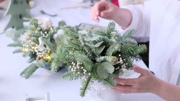 Woman Decorated a Christmas Table Decoration alt