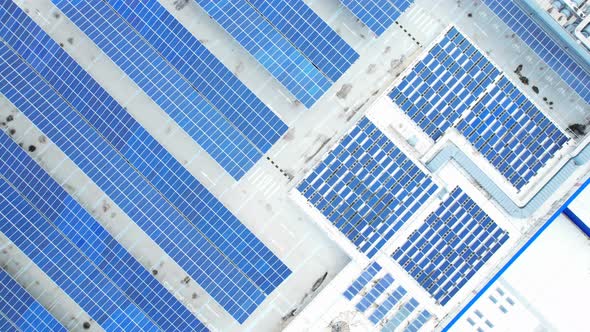 Aerial cinematic view of a solar panel on mall roof top alt