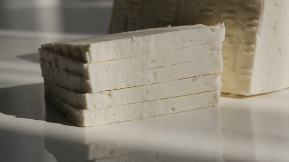Stack of white cow milk cheese  4K footage alt