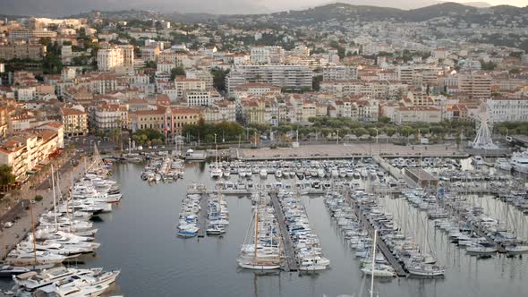 Sunrise in the Port of Cannes With Yachts and Ships Moored in the Marina alt