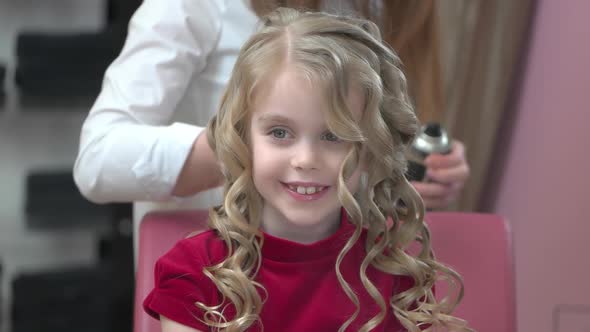 Little Girl at Hairdresser Smiling alt