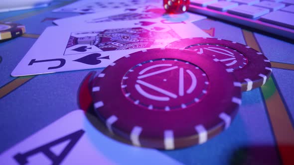 Gaming Table with Computer Keyboard Cards Dice and Casino Chips alt