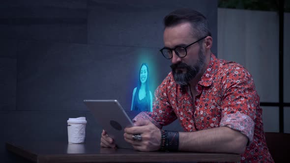 Hipster Man is using a holographic tablet, a woman dancing,  future technology concept