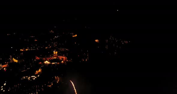 Aerial of fireworks celebration above ski resort. alt