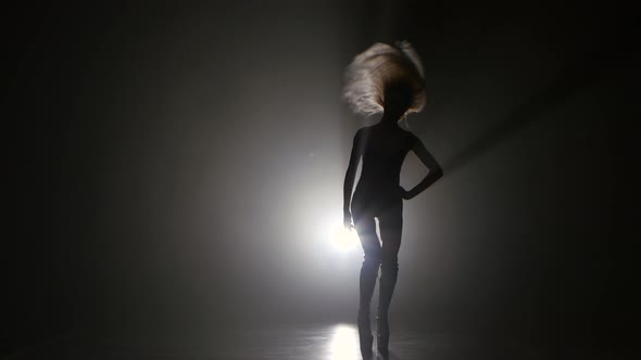 Blonde Sexy Girl Dancing on High Heels. Dark Smoke Studio alt