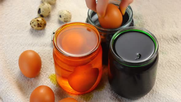Young Child Caucasian Ethnicity Preparing for the Religious Holiday Easter Dyeing Eggs with Spoon alt