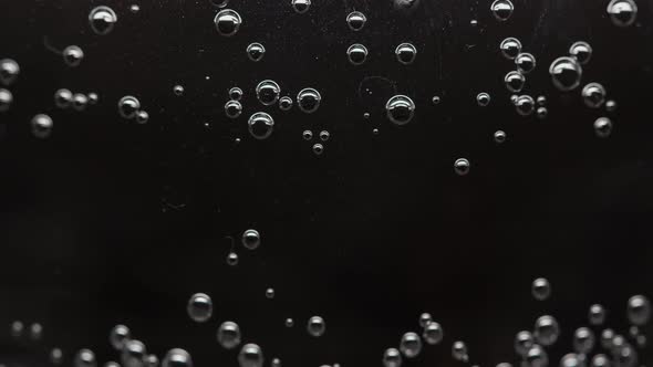 Bubbles In A Glass With Soda, Clear Water, Dark Background