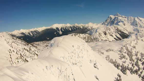 Spectacular Helicopter Aerial 4k Footage Flying Over Table Mountain Top Skiers Towards Mount Baker alt