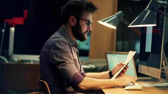 Businessman Analyzing Digital Sales Charts. Focused Trader Reading Corporate Financial Audit Report. alt