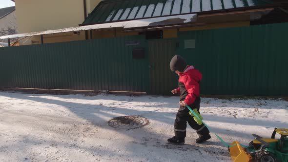 Boy Walking In Winter Suburb Slow Motion alt