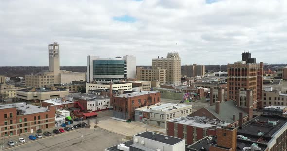 Downtown Pontiac, Michigan skyline with drone videoing forwards. alt