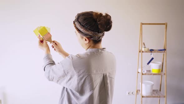 Woman Match Paint Color Before Renovate Room