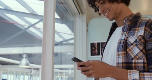 Young man working in a creative office alt