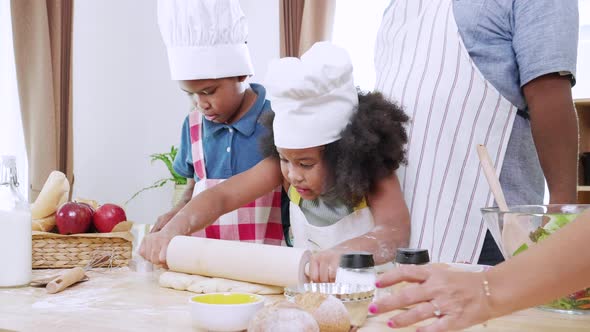 Love moment of Happy black family having fun during cooking together at home