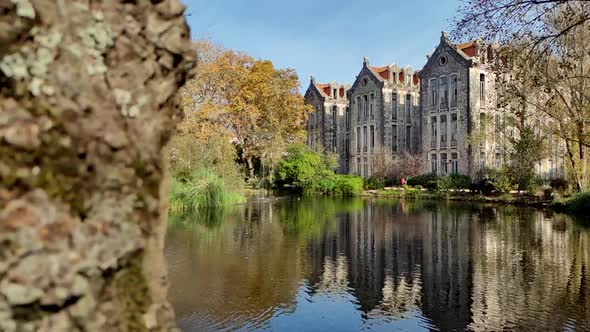 Old Building With Reflection On Lake Water - Parque D Carlos I In Portugal - slow motion revealing s alt
