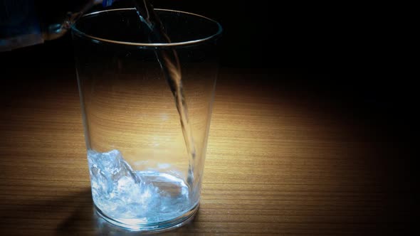 Water Pouring Into Transparent Glass alt