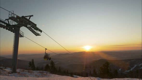 Silhouette of Ski Lift on Mountain Hill at Resort at Sunset alt