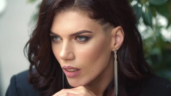 Portrait of a Girl Sitting at a Table alt