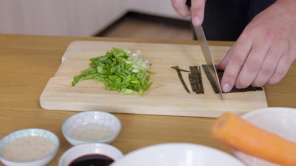 Close Up Male Cook Cuts Nori Dry Seaweed Sheet, Ingredients of Wholesome Meal