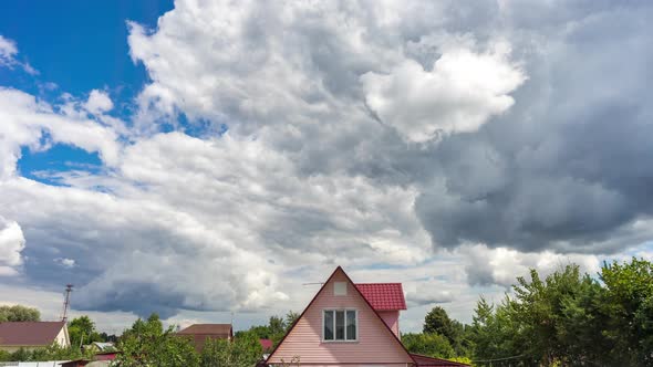 Time Lapse Of Moving Clouds On Sky Over The Village