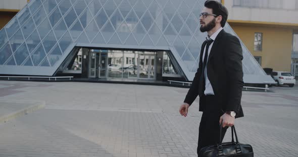 Stylish Business Man Walking Down the Business alt
