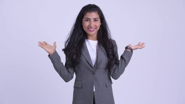 Young Happy Persian Businesswoman Comparing Something alt