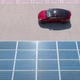 Aerial View Red Electric Car Driving Along Parking Lot with Solar Panel Roof - VideoHive Item for Sale