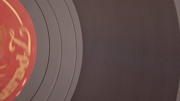 Old Retro Vinyl Music Disc Spinning on the Record Player Close Up