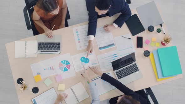 Group of Asian business diverse brainstorm meeting to colleagues at the modern office. alt
