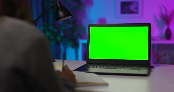 Woman with Green Screen Compuer