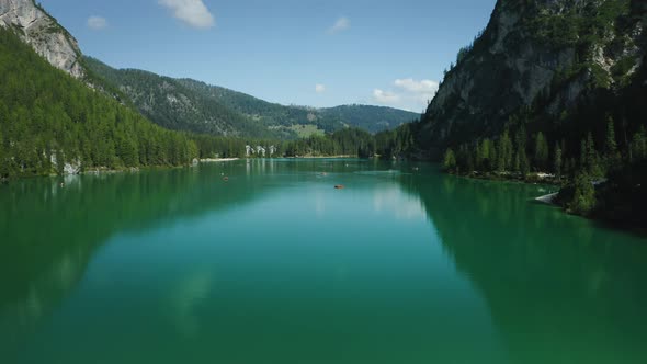 Aerial Footage Over Lake Braies Pragser Wildsee and Mountains in the Background on a Sunny Bright alt