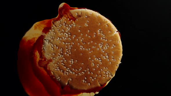 Crush The Whole Burger On A Black Background