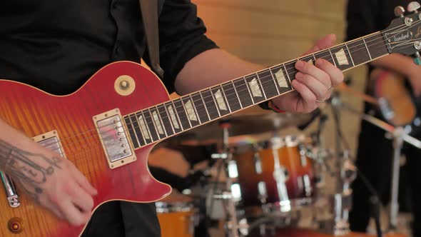 Guitarist Playing Electric Guitar at Concert Closeup.Live Performance with Band alt
