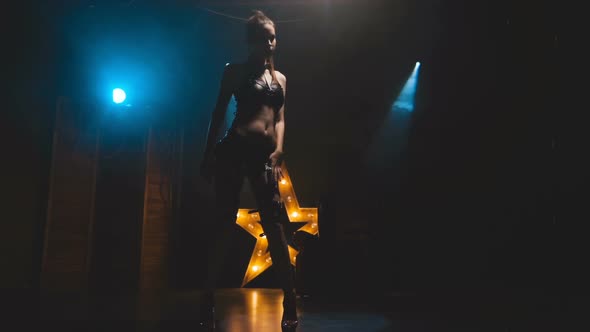 Beautiful Woman in Black Lingerie and Leather Belt Dominates alt