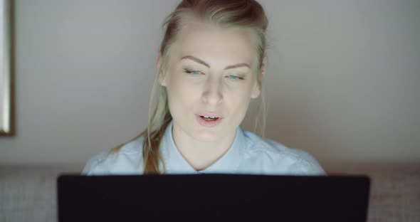 Smiling Woman Working on Laptop at Home Office. Businesswoman Typing on Computer Keyboard. alt