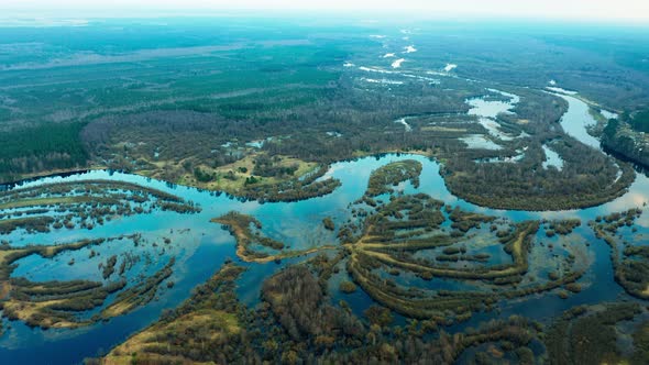 Spring flood, overflow of a large river from a bird's eye view.