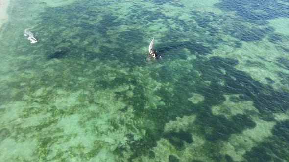 Aerial View of a Boat in the Ocean Near the Coast of Zanzibar Tanzania alt