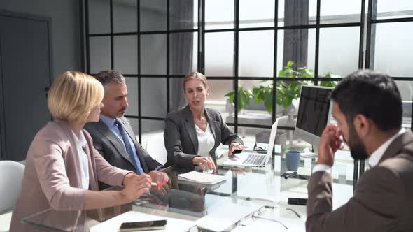 Startup Business Team on Meeting in Modern Bright Office Interior Brainstorming alt