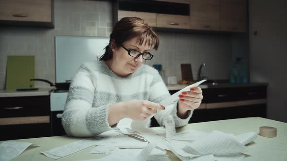 Serious Worried Woman Examines the Purchases Made Shopping Spends a Lot of Money Cinematic alt