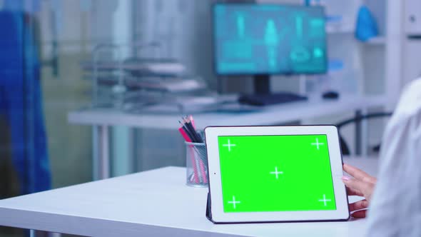 Medical Physician Wearing White Coat Using Tablet Pc alt