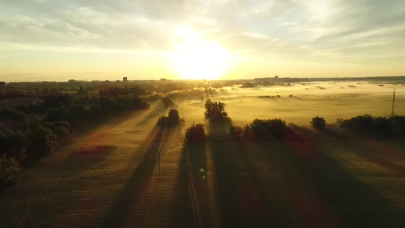 Morning Fog in the Rays of Sunrise