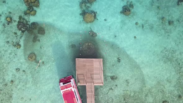 Drone footage from Malaysia island. Beach side tropical season feel. alt