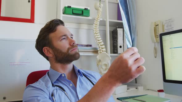 Doctor working on this office in a retirement home alt