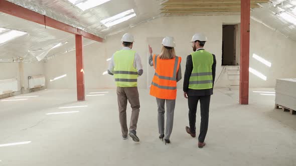 Group of Three People Two Businessman Investor and Architect Discuss the Plan alt