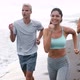 Group of Young Friends Running and Exercising on the Beach - VideoHive Item for Sale